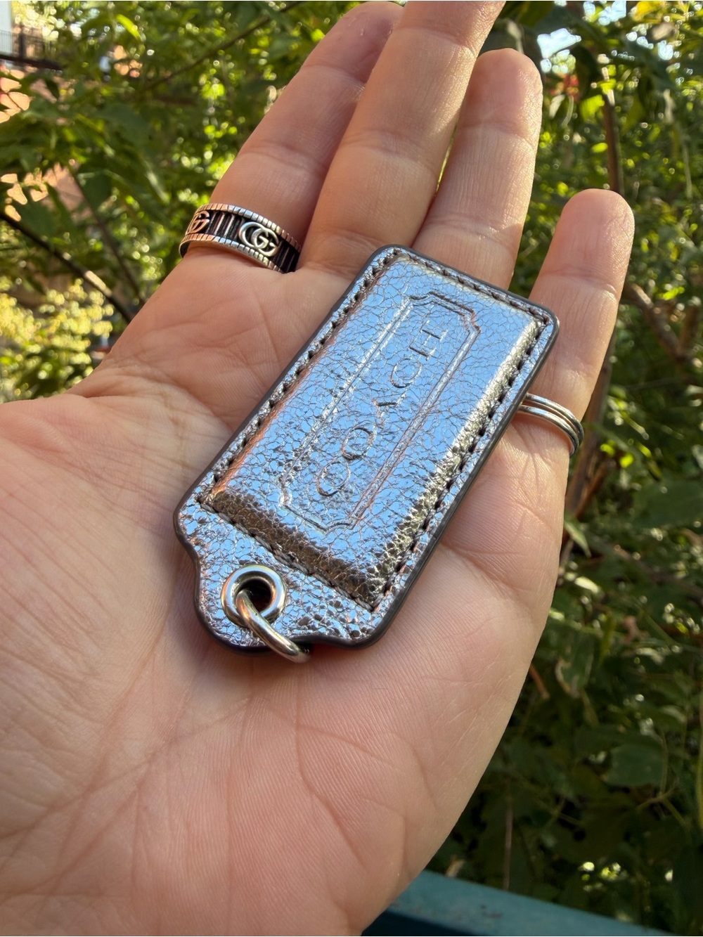 Coach Metallic Silver Leather Tag